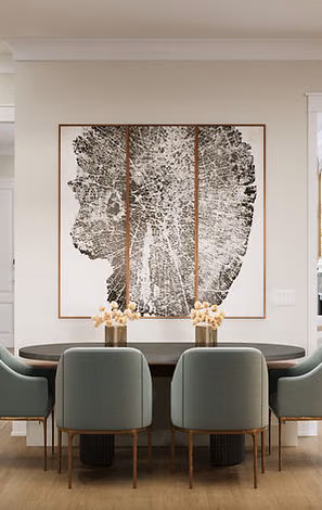 Dining nook with green chairs and wall art