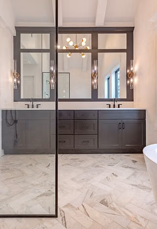 Bathroom with glass shower and gray vanity