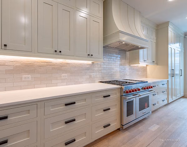 White kitchen range wall with subway tile
